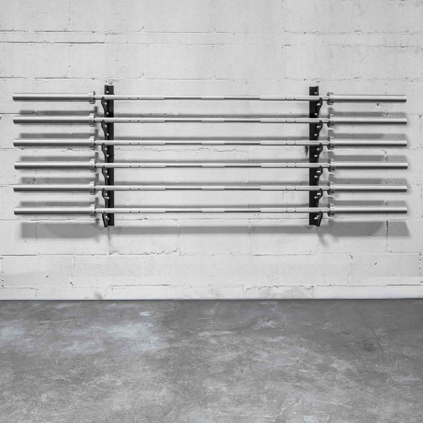 Rack your barbells with style on this rack that attaches to the wall and takes close to no space.