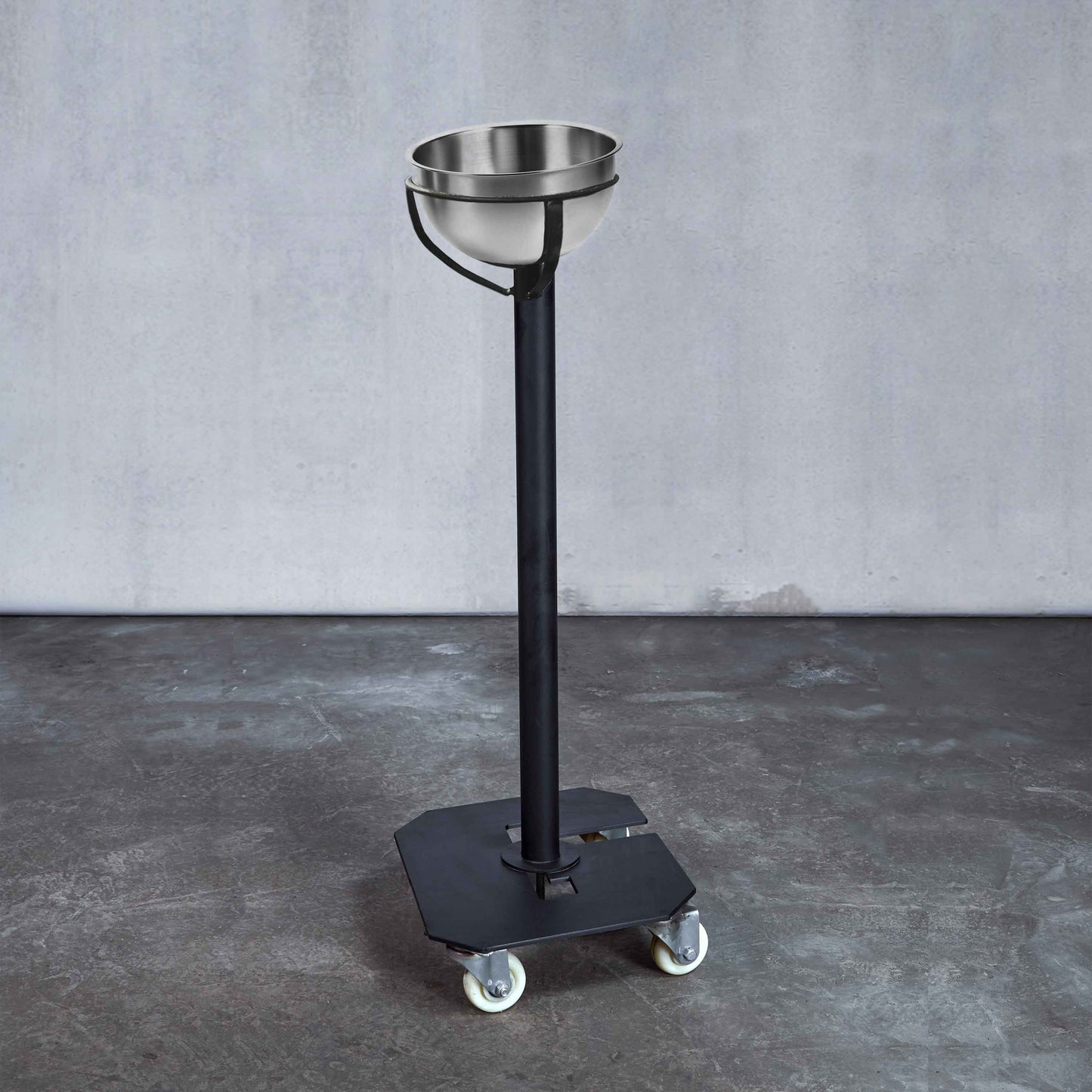 A free standing stainless steel chalk bowl on wheels to easily move around your gym.