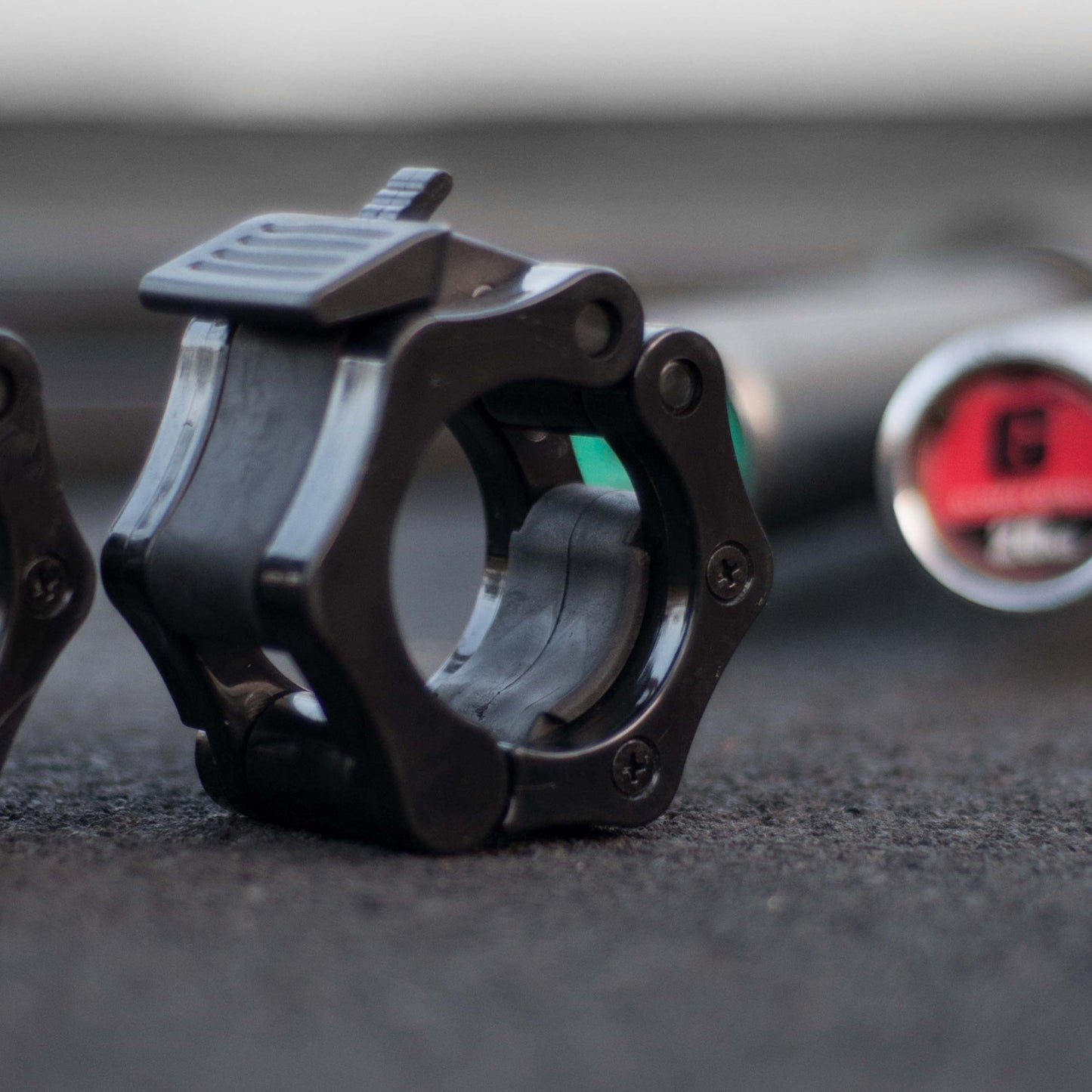 A quick release tab collar with built in rubber padding to lock on your barbell